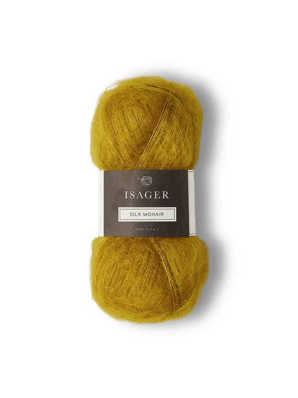 A skein of Isager Silk Mohair in golden yellow with a gray brand label is shown on white, featured alongside the Cumulus Blouse neuleohje—ideal for your next knitting project.