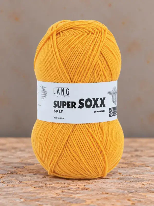 A skein of bright yellow Lang Yarns Super Soxx 6 ply – kestävä sukkalanka villasta with a product label around the center.
