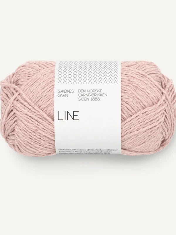A skein of pale pink “Sandnes Garn Line” yarn with a white Norwegian label—ideal for your Milly Sweater & Skirt Neuleohje Suomi +Sandnes Garn line project.