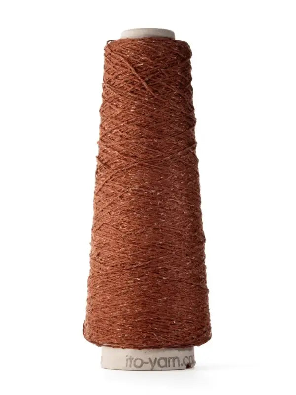 A spool of brown textured yarn, Ito Kinu crafted from 100% silkki japanilainen silkkilanka, is wound around a tall, cone-shaped core with a white base and set against a plain white background—ideal for kesäneuleet projects.