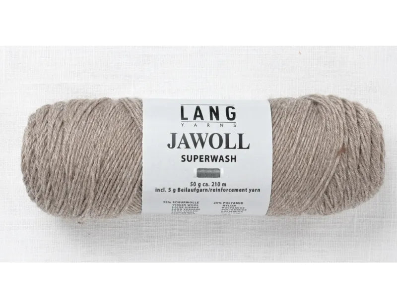 A skein of Timo sukka ohje fingerin ja Lang jawoll light brown yarn with a white label rests on a white textured surface—ideal for your favorite knitting or Timo sukka projects.