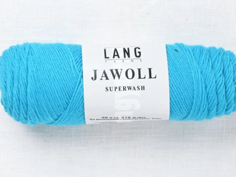 A skein of bright blue Timo sukka ohje fingerin ja Lang jawoll yarn with a white label sits on white fabric—ideal for your favorite sock knitting patterns or neulontaohje.