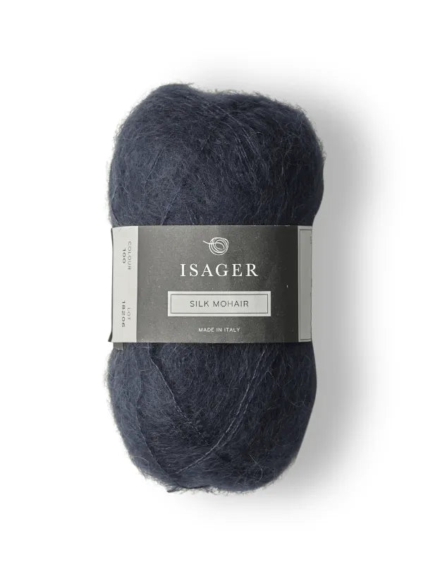 A skein of dark blue Isager Silk Mohair yarn, paired with the Cumulus Blouse neuleohje, wrapped in a gray label with brand and details, displayed on a white background.