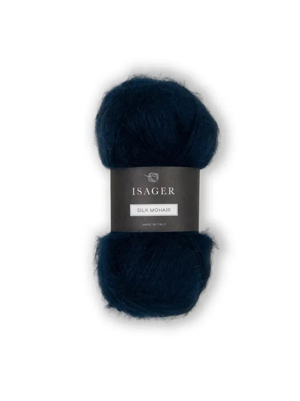 A skein of dark blue Isager Silk Mohair with a black label is shown on a white background, ideal for the Cumulus Blouse neuleohje or other knitting projects—soft, fuzzy, and perfect for your next creation.