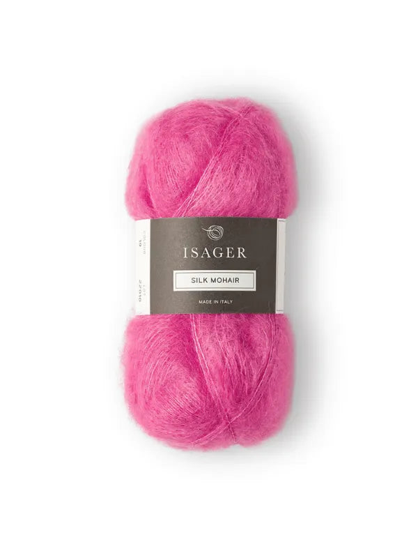 A skein of bright pink Isager Silk Mohair yarn with a gray and white label is shown, perfect for your next Cumulus Blouse neuleohje. The label features the brand name and product details.