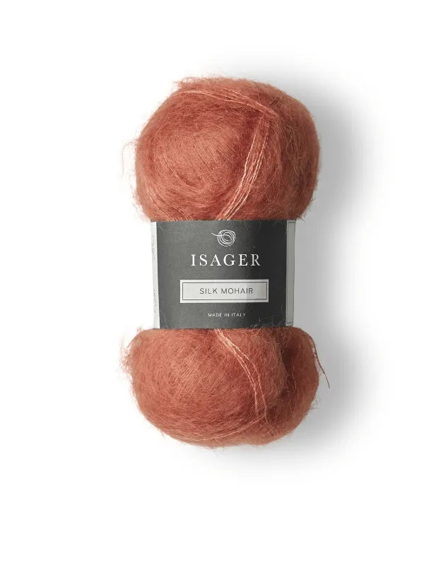 The Cumulus Blouse neuleohje + Isager Silk Mohair set features a soft, dusty rose skein with a dark gray label—ideal for your next knitting project or making the elegant Cumulus Blouse.