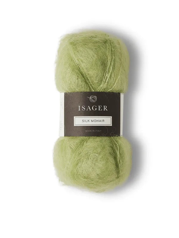 A skein of light green Isager Silk Mohair, labeled with brand and product details, ideal for knitting the Cumulus Blouse neuleohje. Product: Cumulus Blouse neuleohje + Isager Silk Mohair. Set against a white background.