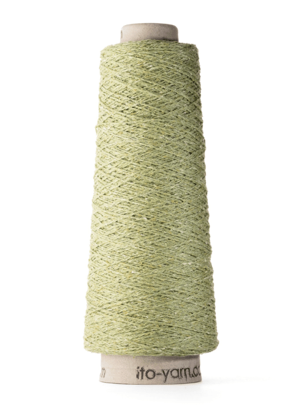 A tall cone of Ito Kinu, light green textured japanilainen silkkilanka yarn, is wound on a cardboard core—perfect for kesäneuleisiin projects—and stands upright against a white background.