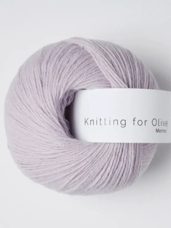 A ball of light lavender Knitting for Olive Merino yarn with a white label is displayed against a plain white background.