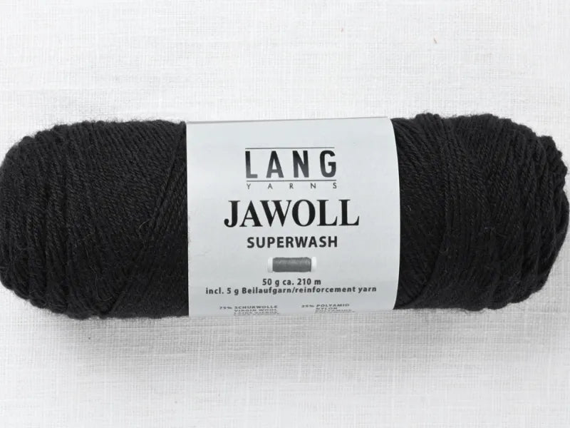 A skein of black Timo sukka ohje fingerin ja Lang jawoll yarn (50g, 210m) with a white label and reinforcement yarn inside, ideal for Timo sukka ohje or other knitting patterns, placed on a light textured surface.
