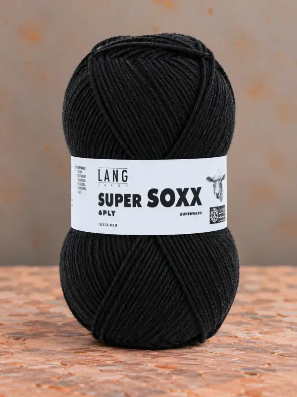 A ball of black Lang Yarns Super Soxx 6 ply – kestävä sukkalanka villasta yarn with a white product label wrapped around the center.