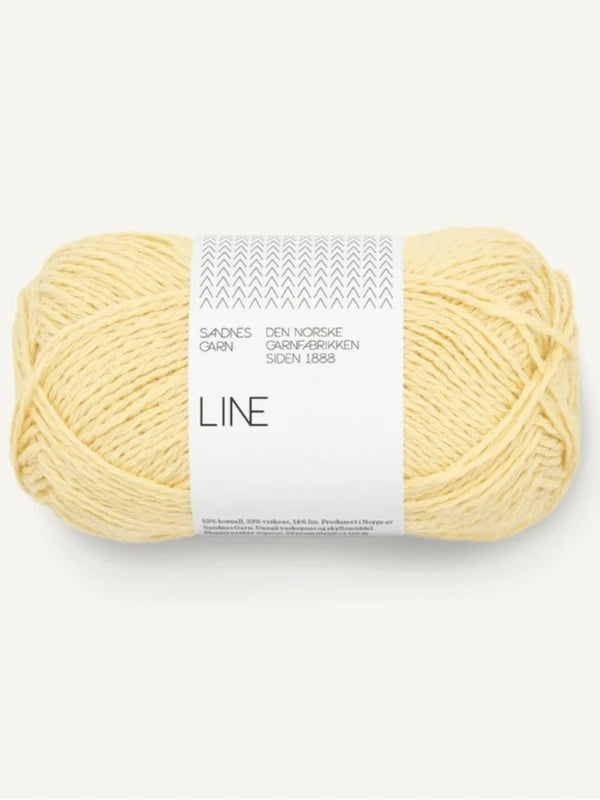 A skein of pale yellow yarn with a “Sandnes Garn Line” label, ideal for your Milly Sweater & Skirt Neuleohje Suomi +Sandnes Garn line project.