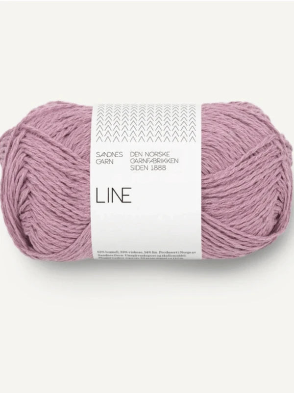 A skein of light purple Sandnes Garn Line yarn labeled "Milly Sweater & Skirt Neuleohje Suomi," with white packaging featuring Norwegian and English text.