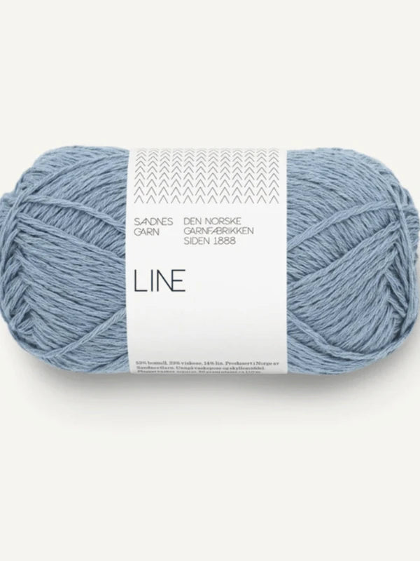 A skein of light blue Sandnes Garn Line yarn with a white, minimalist label—perfect for the Milly Sweater & Skirt Neuleohje Suomi +Sandnes Garn line neulesetti.
