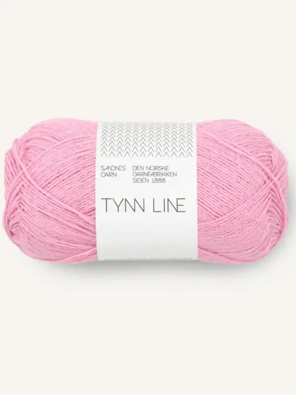 A skein of Sandnes Garn Tynn Line, a light pink fingering-weight yarn with Norwegian text on a white paper band—ideal for summer knits.