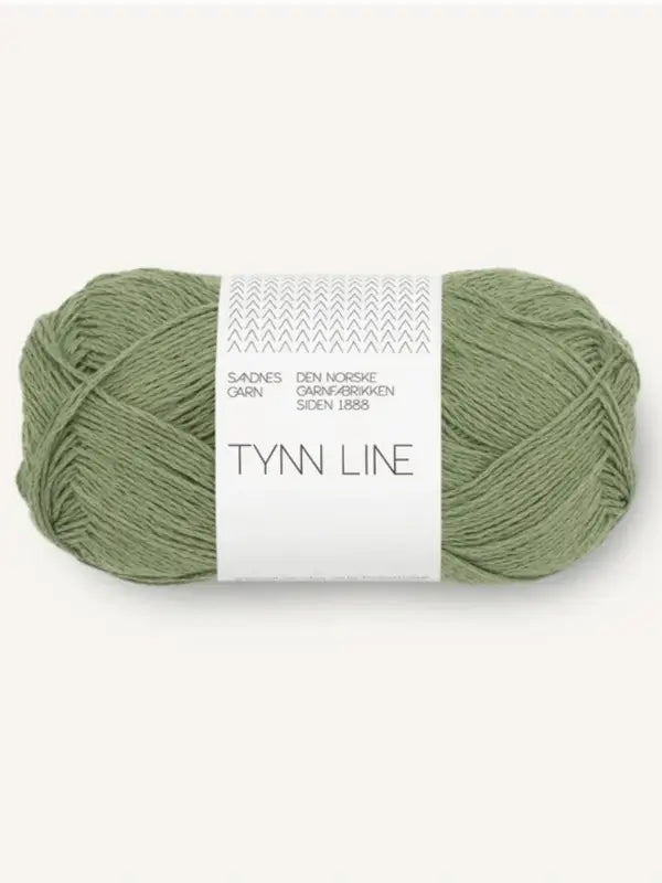 A skein of Sandnes Garn Tynn Line yarn in light green with white minimalist packaging is shown against a pale background—ideal kesäneulelanka and perfect for fingering-weight (vahvuinen) projects.