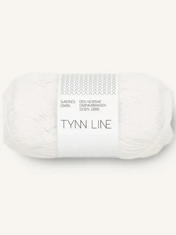 A skein of Sandnes Garn Tynn Line, a white fingering-weight yarn ideal for summer knits, wrapped in a white paper band with minimalist black text and a subtle zigzag design at the top.