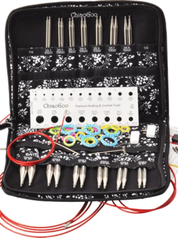 A black floral fabric case holds the ChiaoGoo TWIST Complete - Set along with colorful stitch markers, cables, and a white needle size gauge for knitting and crochet.